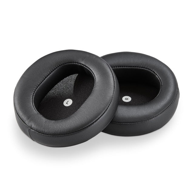 Black leather ear cushions for headphones, featuring a sleek oval design for enhanced comfort and style.